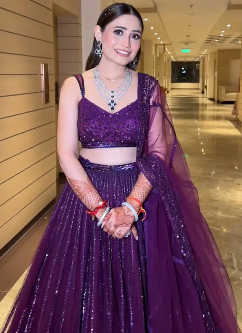 Beautiful Heavy Embroidered Reception Wear Purple Net Lehenga Choli - Image 2