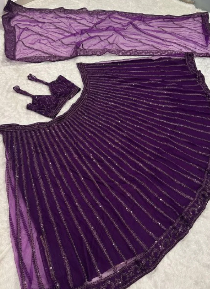 Beautiful Heavy Embroidered Reception Wear Purple Net Lehenga Choli - Image 5