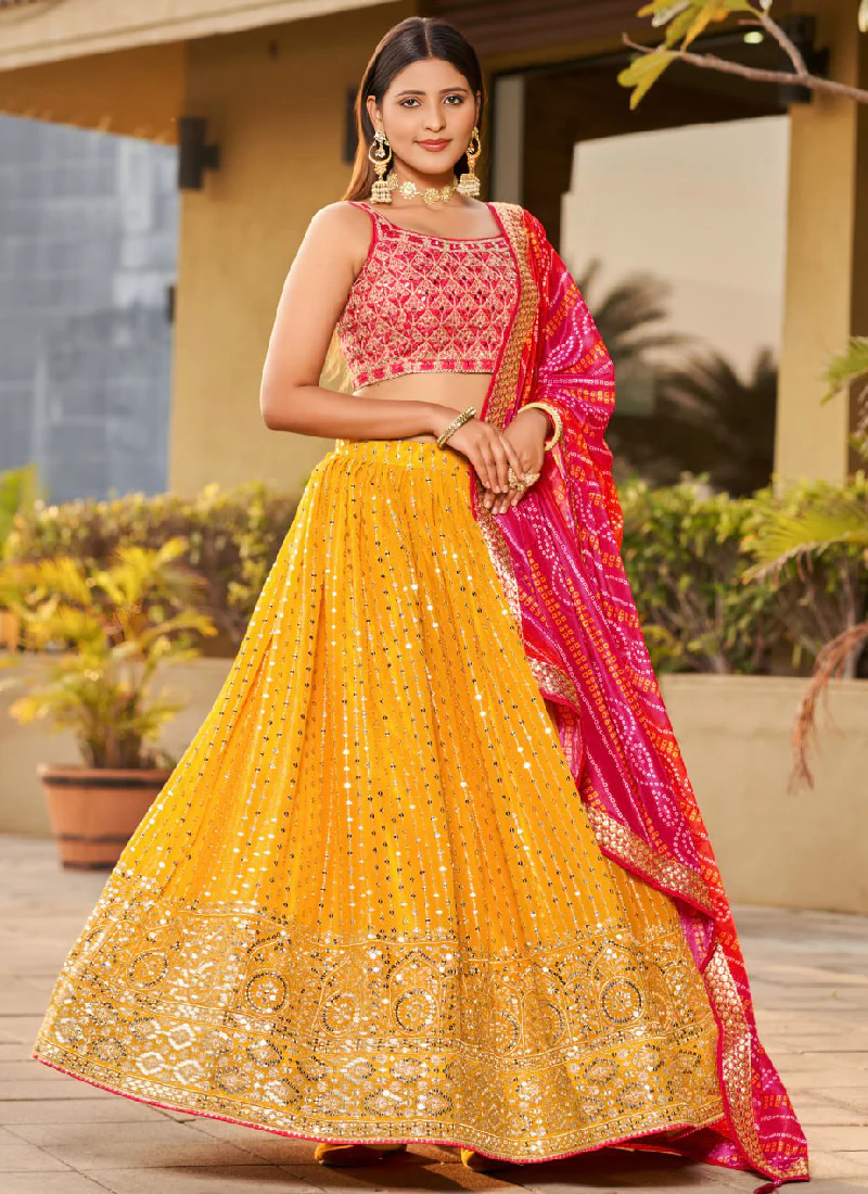 Mesmerizing Embroidered Georgette Yellow Lehenga With Pink Choli Set