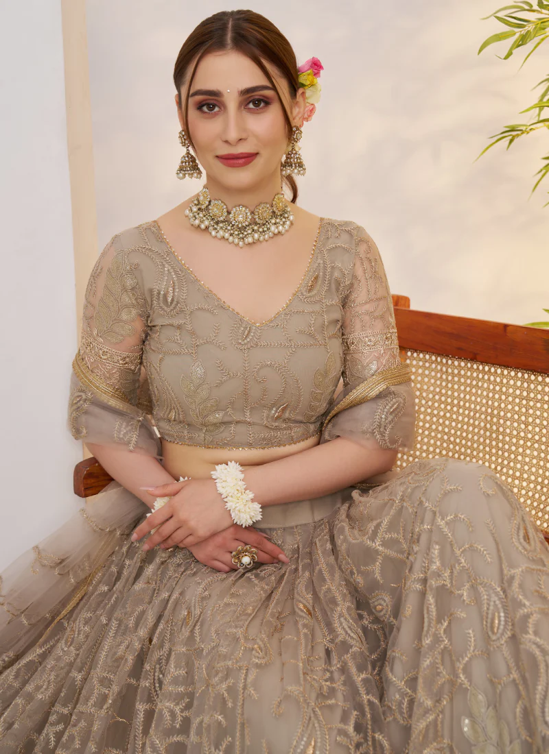 Prettiest Sequence Embroidered Cream Net Wedding Wear Lehenga Choli - Image 2