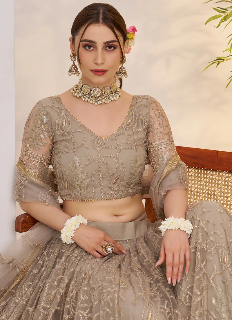 Prettiest Sequence Embroidered Cream Net Wedding Wear Lehenga Choli - Image 7