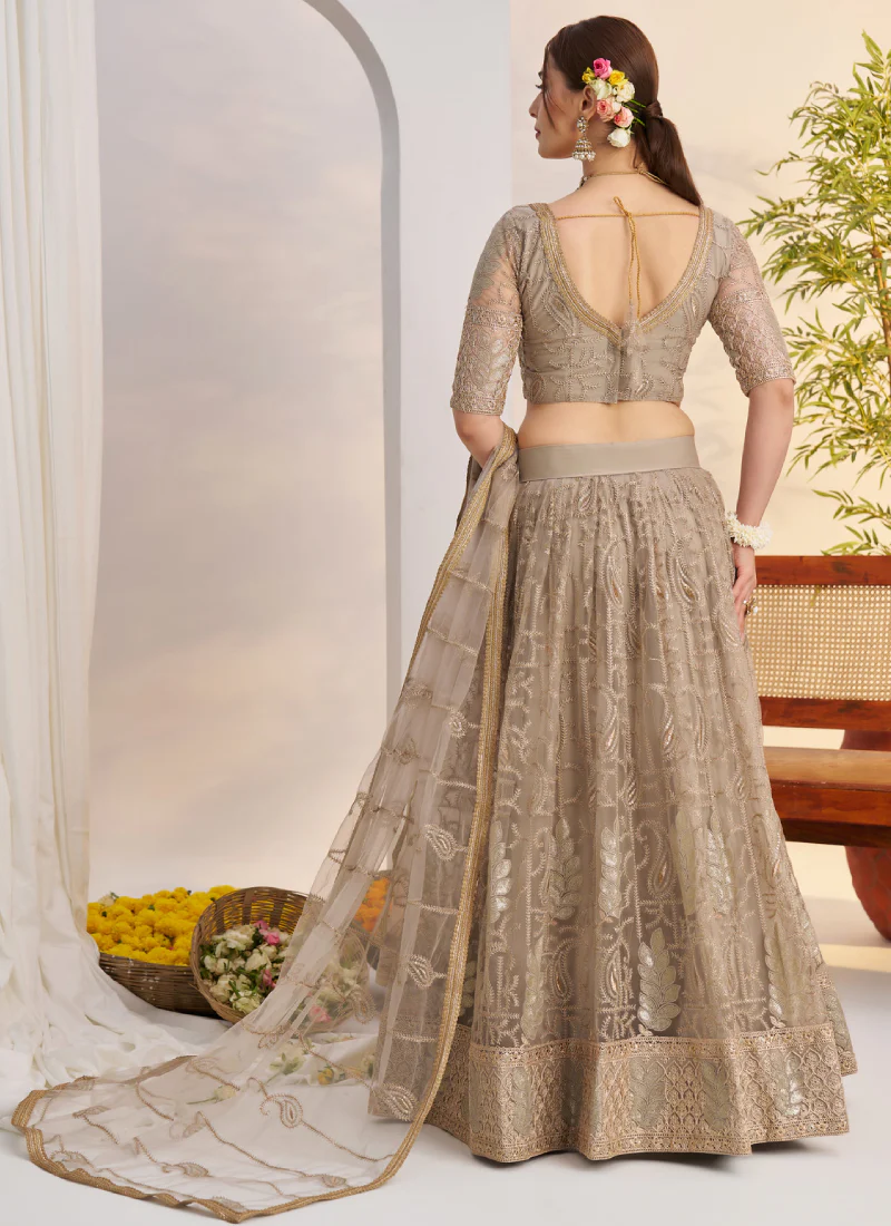 Prettiest Sequence Embroidered Cream Net Wedding Wear Lehenga Choli - Image 8